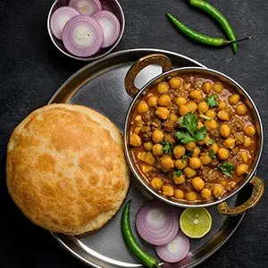 Chole Bhature recipe - spicy Punjabi chickpea curry served with fried bhature bread