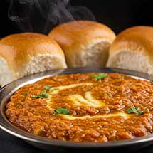 Pav Bhaji Mumbai street food spicy vegetable curry with buttered buns